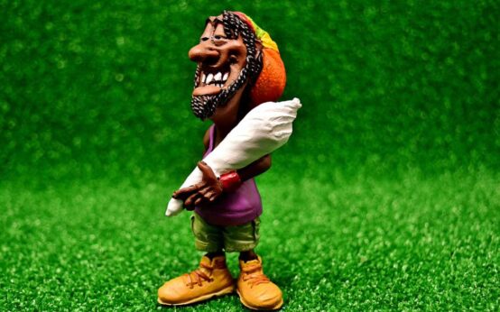 Kiffer im Grün. Comic. symbolbild